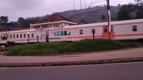 Motorcyclist Has Close Call with Oncoming Train