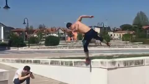 Shirtless red shoes ledge parkour