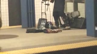 Basket head guy plays guitar in subway