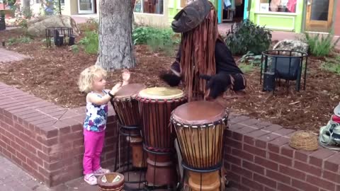 3-Year-Old Toddler Joins Street Performer In Colorado