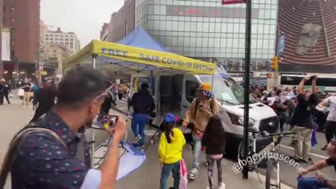 Two marchers flip over COVID-19 mobile testing tent in Union Square in New York