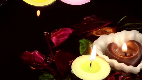 Romantic candles floating in water