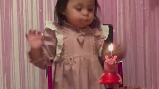 Toddler Tries Her Hardest to Blow Out Birthday Candle
