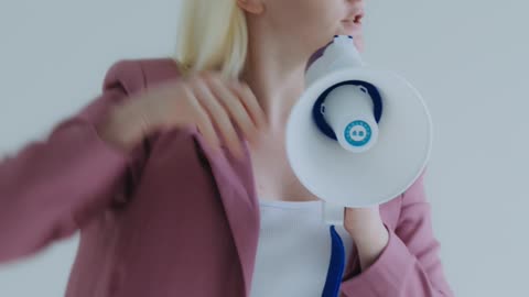 A Woman Screaming on a Megaphone