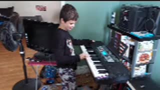 my son eric playing memories on his piano