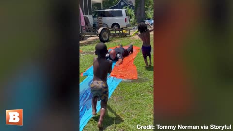 Police Officer Cools Down on Slip-and-Slide with Kids in Arkansas Heat
