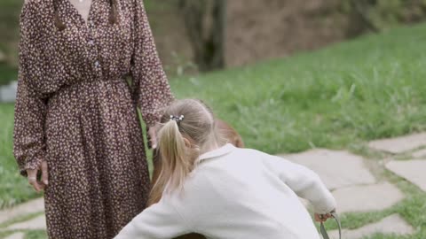 The girl is washing a little horse