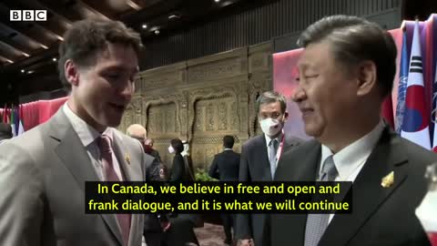 China and Canada leaders caught having tense exchange on camera - BBC News