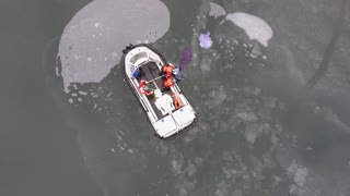 SWAN UPMANSHIP: Hovercraft Rescues Swan Stuck In Frozen Lake
