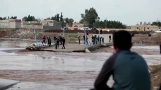 Family searches for teens lost in Syria flood