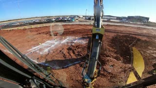 Backhoe digging footings