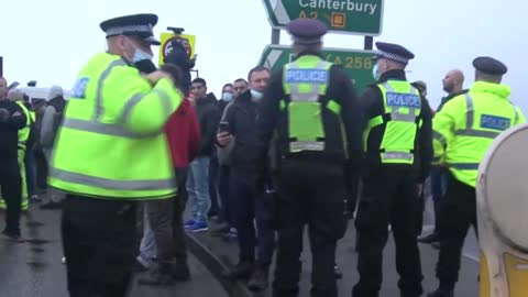 Angry lorry drivers confront police officers at Dover port