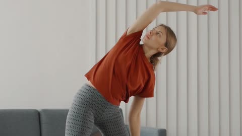A Woman Exercising At Home