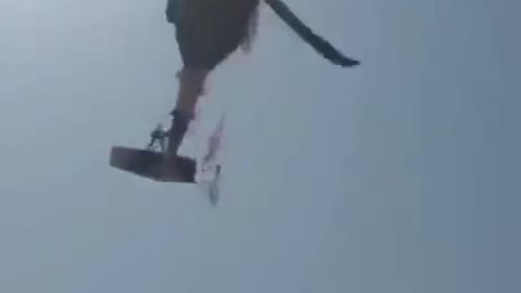 US Military Blackhawk helicopter flying in Afghanistan with a Taliban flag