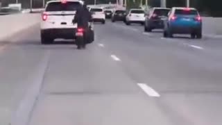 COP TRIES TO RUN MOPED RIDER OFF THE ROAD