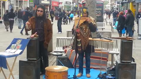 Busker playing Pipes