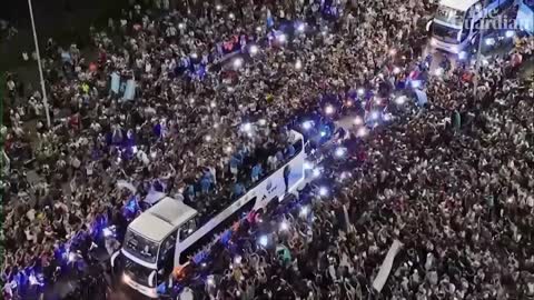 Argentina fans swarm streets at 3am to welcome home World Cup winners