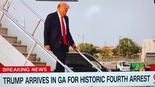 TRUMP GIVES BIG THUMBS UP AS HE WALKS DOWN THE STAIRS IN ATLANTA GEORGIA, NOW ON HIS WAY TO FULTON..