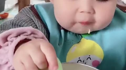 cute baby eating rice