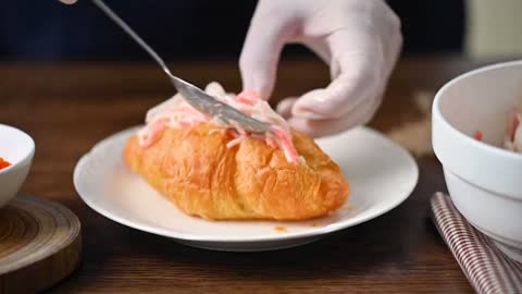 A croissant with all kinds of toppings, easy to do at home.