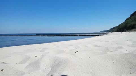 Time Lapse - People Walking By The Shore