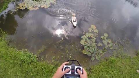 Barbie riding an RC boat catches a fish!