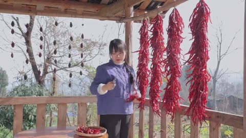 The strings of red peppers under the eaves represent freshness