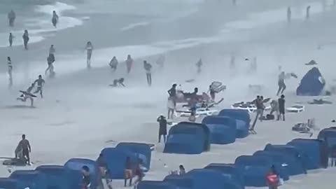 Must Watch ! Footage Captures Waterspout Ripping Through Crowded Beach.