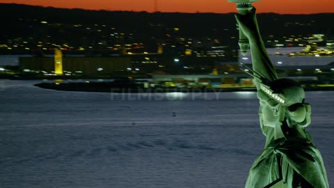 Aerial view of the area around the statue of liberty at sunset