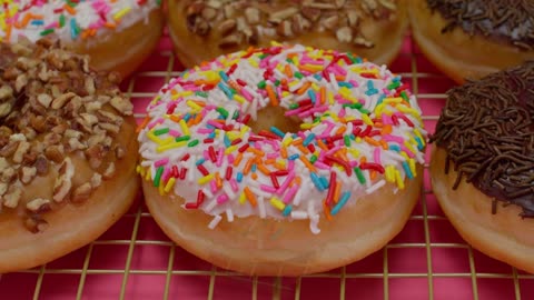 Donuts with various types of icing in a close up shot