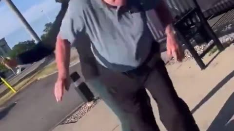 White older man hitting black woman...
