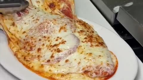 Just the right amount of cheese on this CHICKEN PARMESAN from Marinara Pizza NYC!