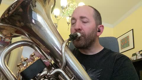 Guy plays Blest Be the Tie that Binds on Euphonium
