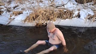 Kyle goes for a dip in the creek