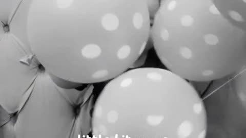 Cute baby playing with balloons