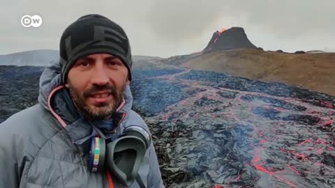 Tourists flock to Iceland volcano, cook food on lava