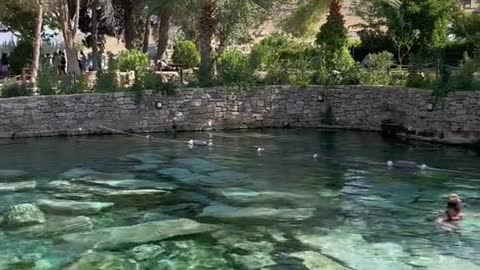 You can swim in an antique geothermal pool formed by