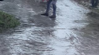 Man Tries Walking Over to Van Over Icy Landscape