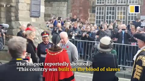 King Charles narrowly avoids being hit by eggs thrown at him during public meeting