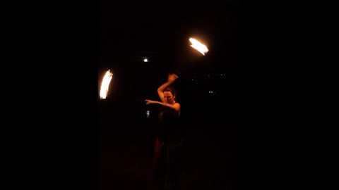 Girl dances with fire