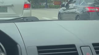Bickering Drivers Throw Their Trash at Each Other