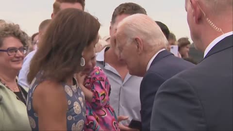 Joe Biden NIBBLES on frightened young girl in Finland