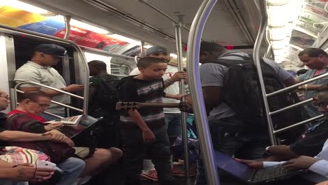 Talented Kid Sings Beautifully On A Subway Train In NYC