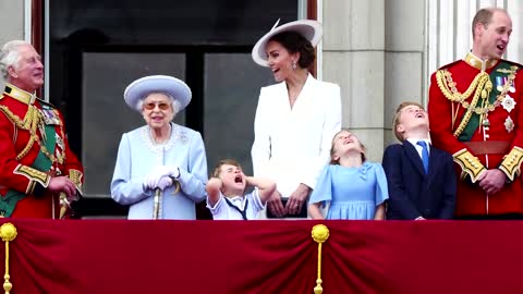 Prince Louis covers ears during fly-past