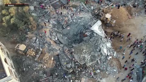 Drone footage shows excavators removing rubble in Gaza neighborhood