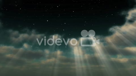 A Starry Sky Emerges Through Clouds And Light Rays (Loop)