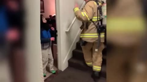 Fireman Communicates With Non-Verbal Kid in Sign Language