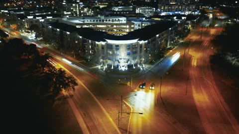 Timelapse of a crossroads in a city at night