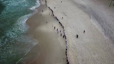 Copacabana beach hug on World Ocean Day