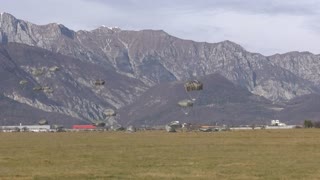 PICTURE PERFECT: Impressive Parachute Drop Against Italian Mountain Background
